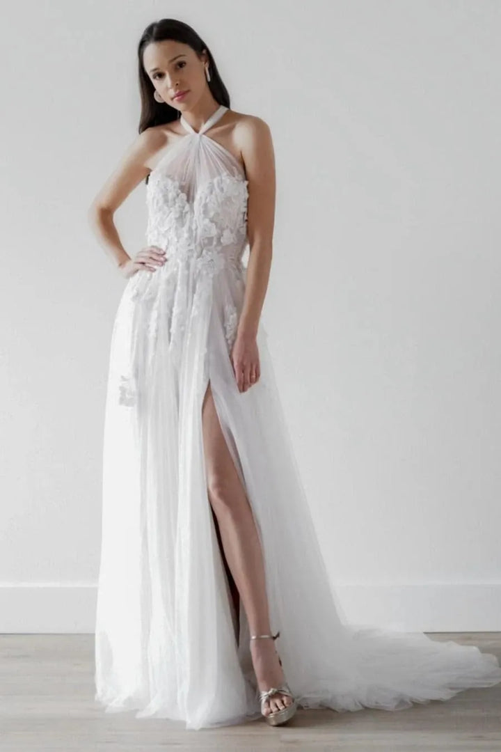 full front of willowby alessandra nude tulle a-line wedding dress with a sheer halter style neckline and floral motifs