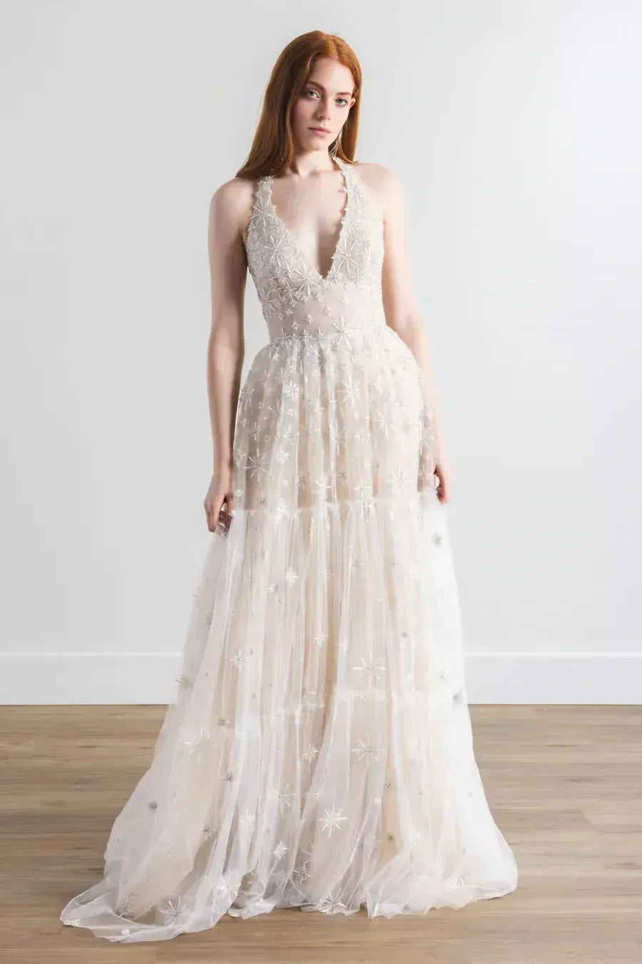 full front of willowby by watters lenny nude tulle a-line wedding dress with intricate embroidery and a halter neckline