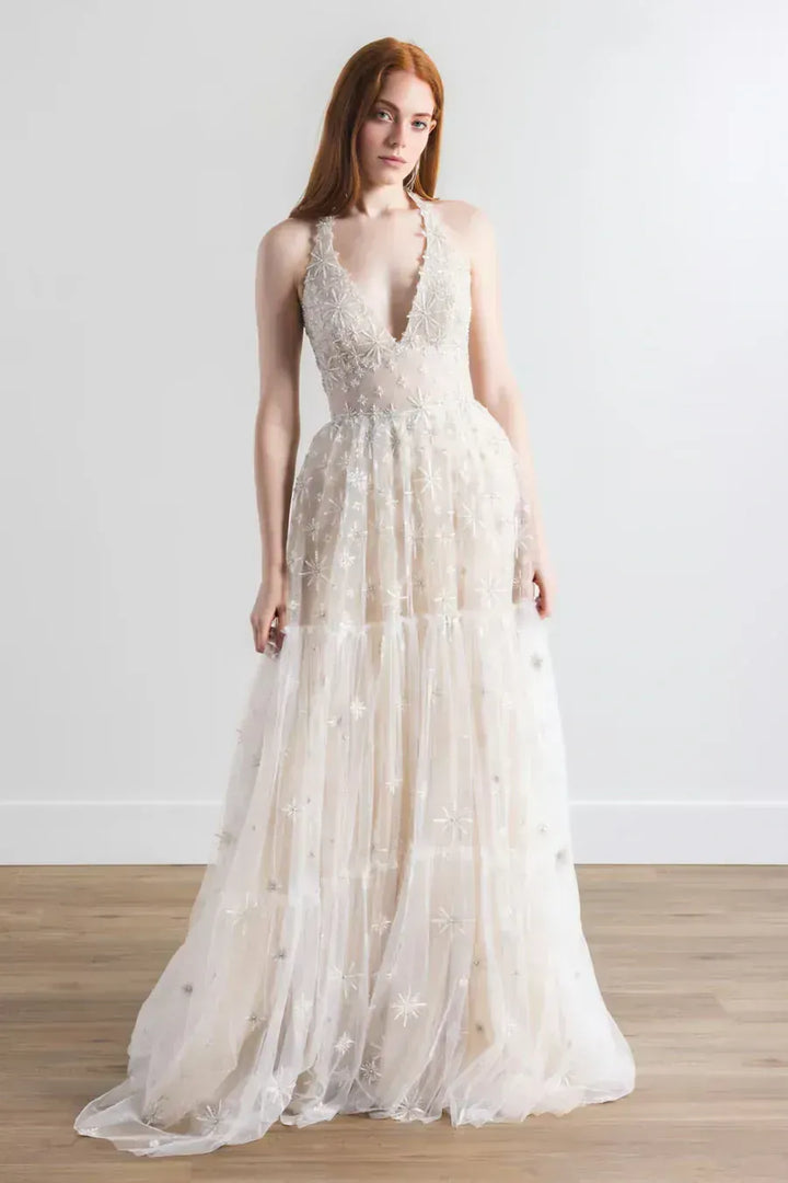 full front of willowby by watters lenny nude tulle a-line wedding dress with intricate embroidery and a halter neckline
