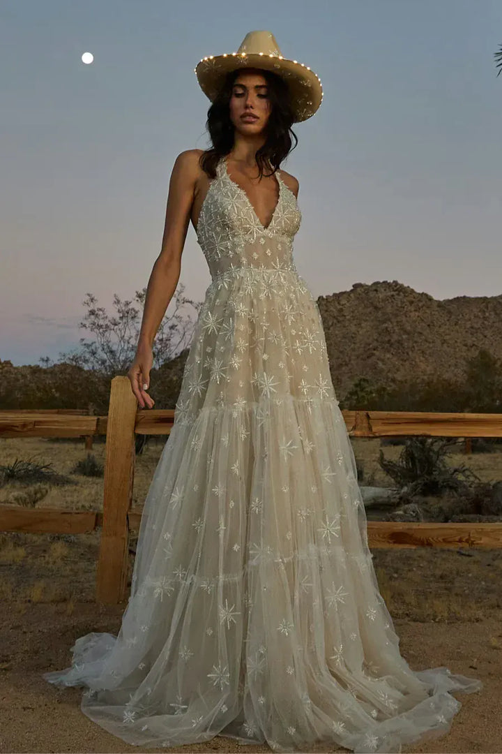 full front of willowby by watters lenny nude tulle a-line wedding dress with intricate embroidery and a halter neckline