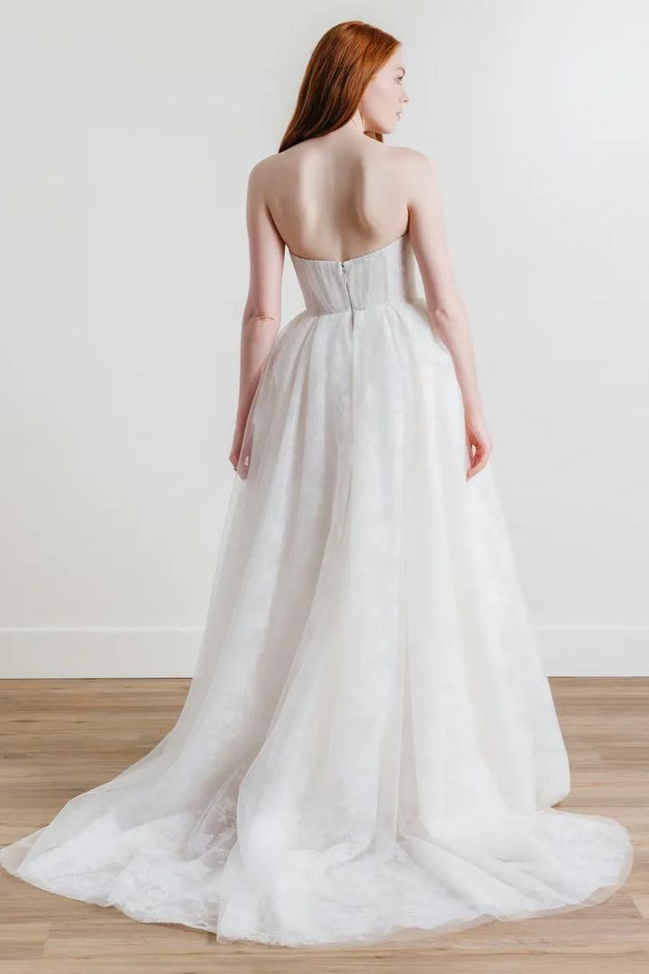 full back of willowby palmer ivory embroidered tulle ball gown with a strapless sweetheart neckline