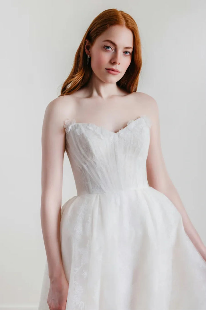 close up of willowby palmer ivory embroidered tulle ball gown with a strapless sweetheart neckline