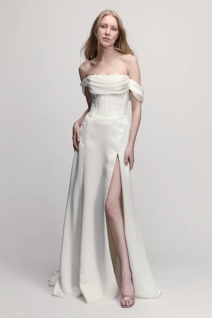 full front of willowby poppy ivory charmeuse wedding dress with detachable straps and a high slit in the skirt