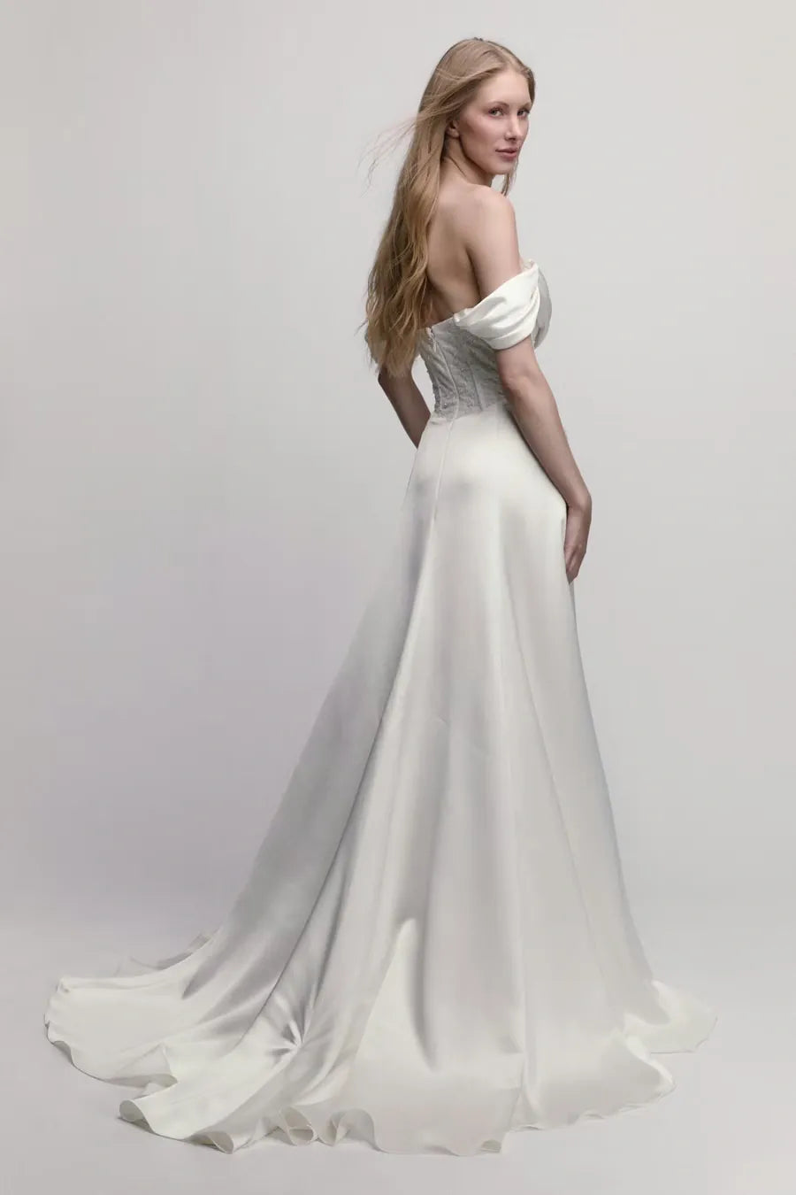 full back of willowby poppy ivory charmeuse wedding dress with detachable straps ad a high slit in the skirt