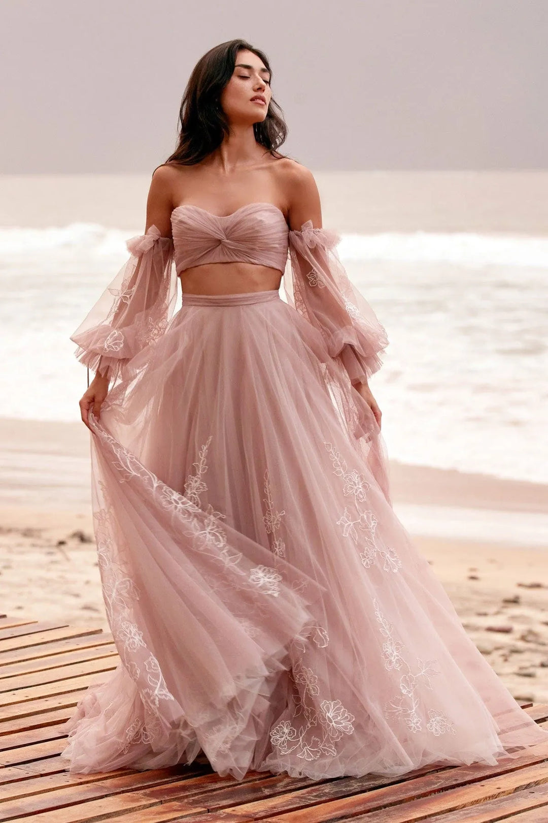 front of willowby by watters renae and innika blush tulle a-line bridal set including sweetheart crop top and a-line skirt, with puffed long sleeves