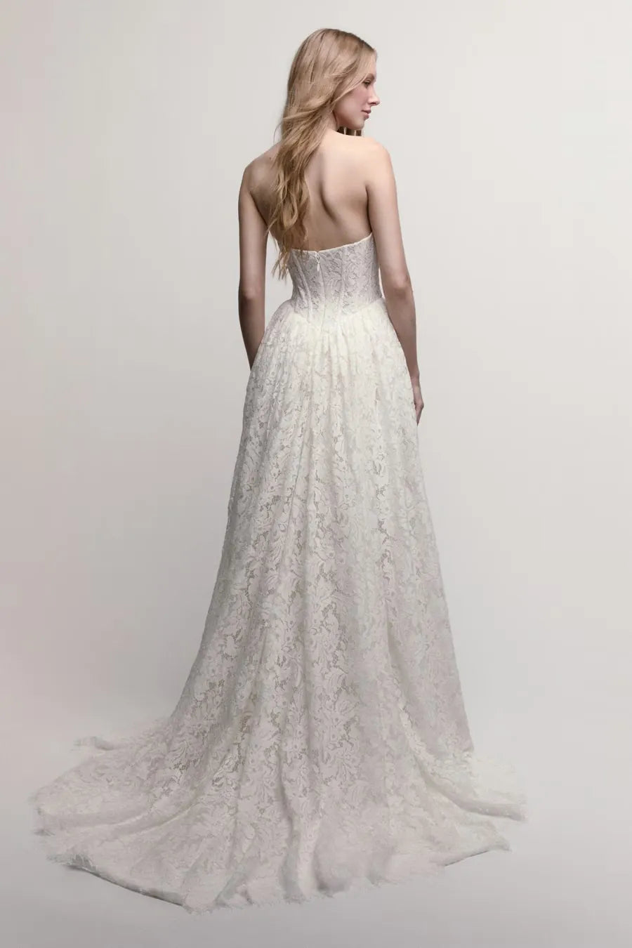full back of willowby steffie ivory lace wedding dress with a basque waist and floral print