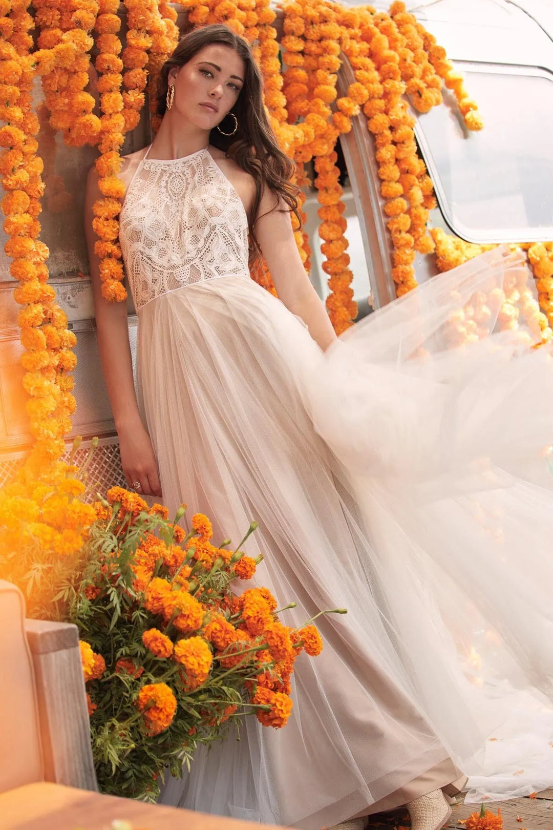 front of willowby by watters kinney champagne tulle a-line wedding dress, showing the full front with a lace bodice and halter neckline