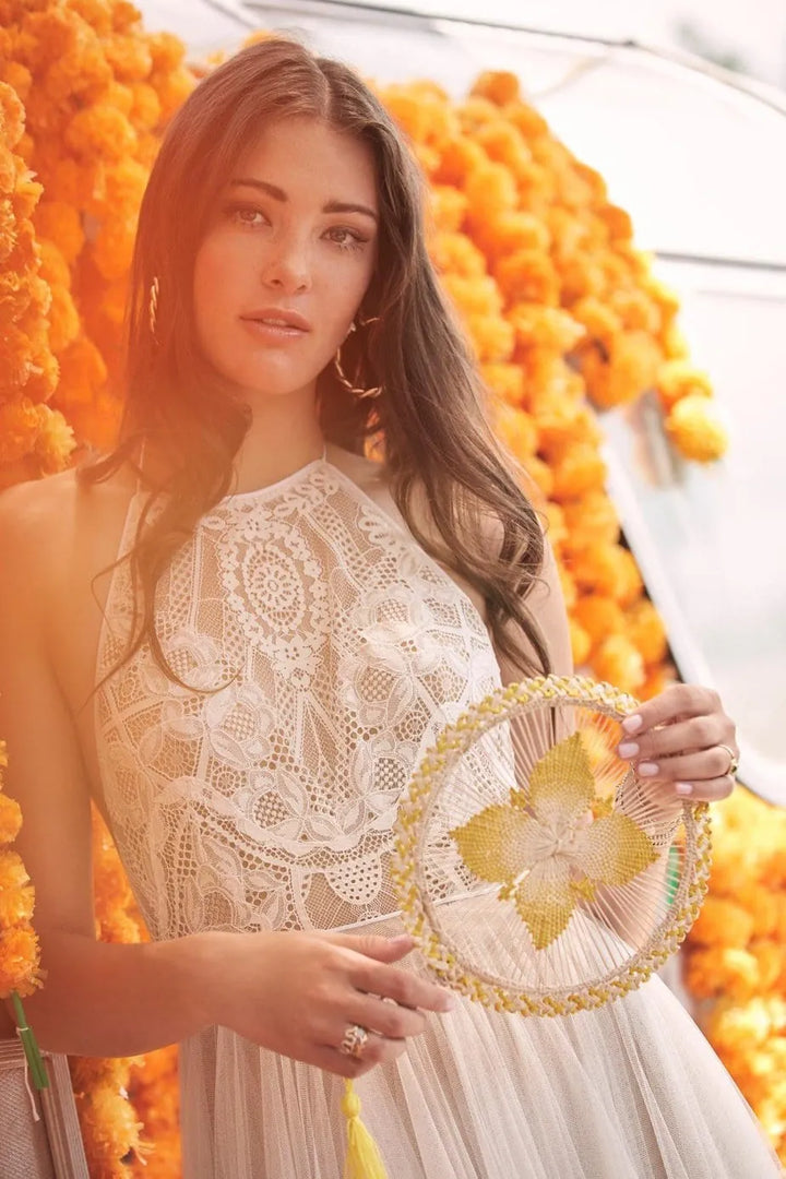 close up of willowby by watters kinney champagne tulle a-line wedding dress, showing the lace bodice with a halter neckline
