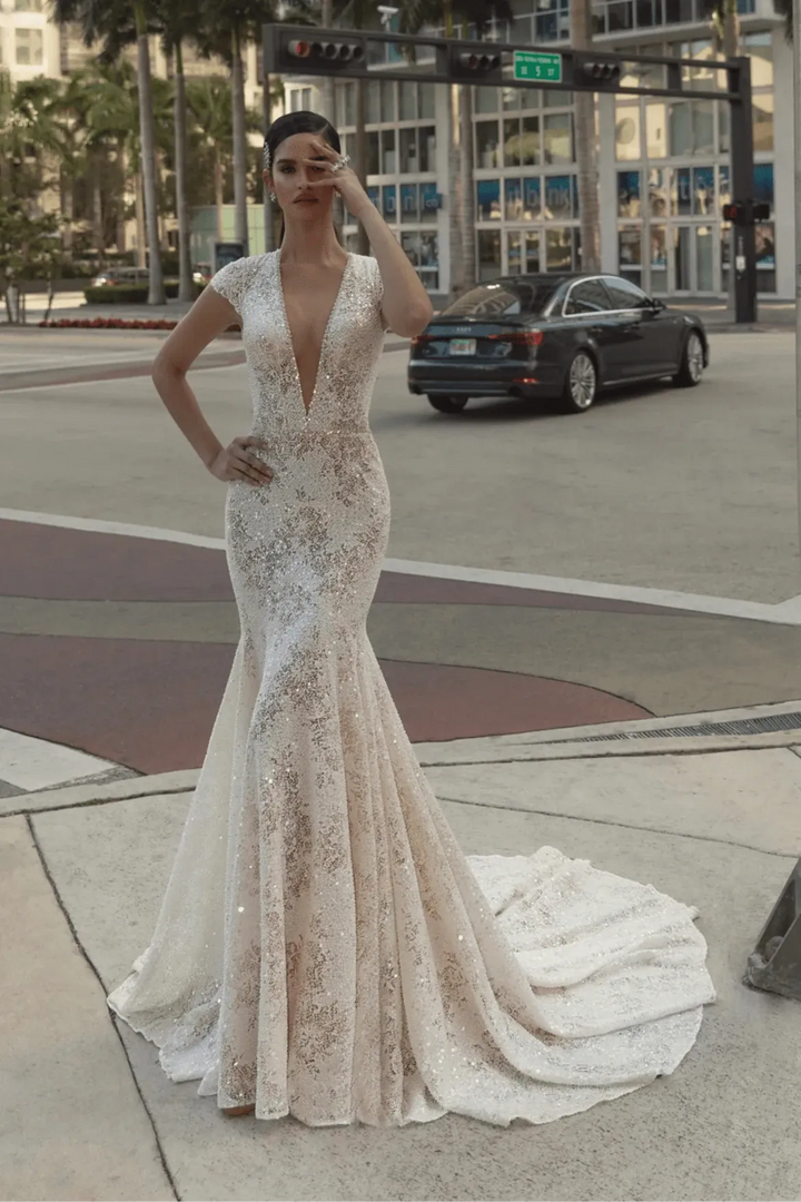 full front of wona olivia ivory lace fit and flare wedding dress with a plunging neckline and cap sleeves