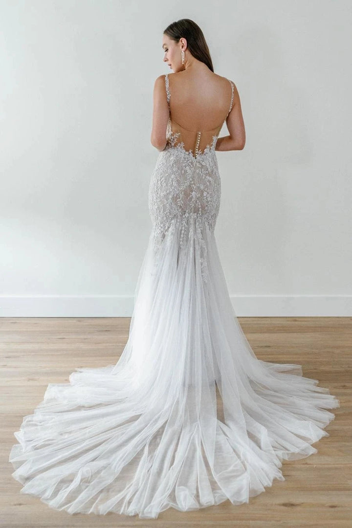 back of watters looksy champagne tulle fit and flare wedding dress with sheer back and wispy chapel length train